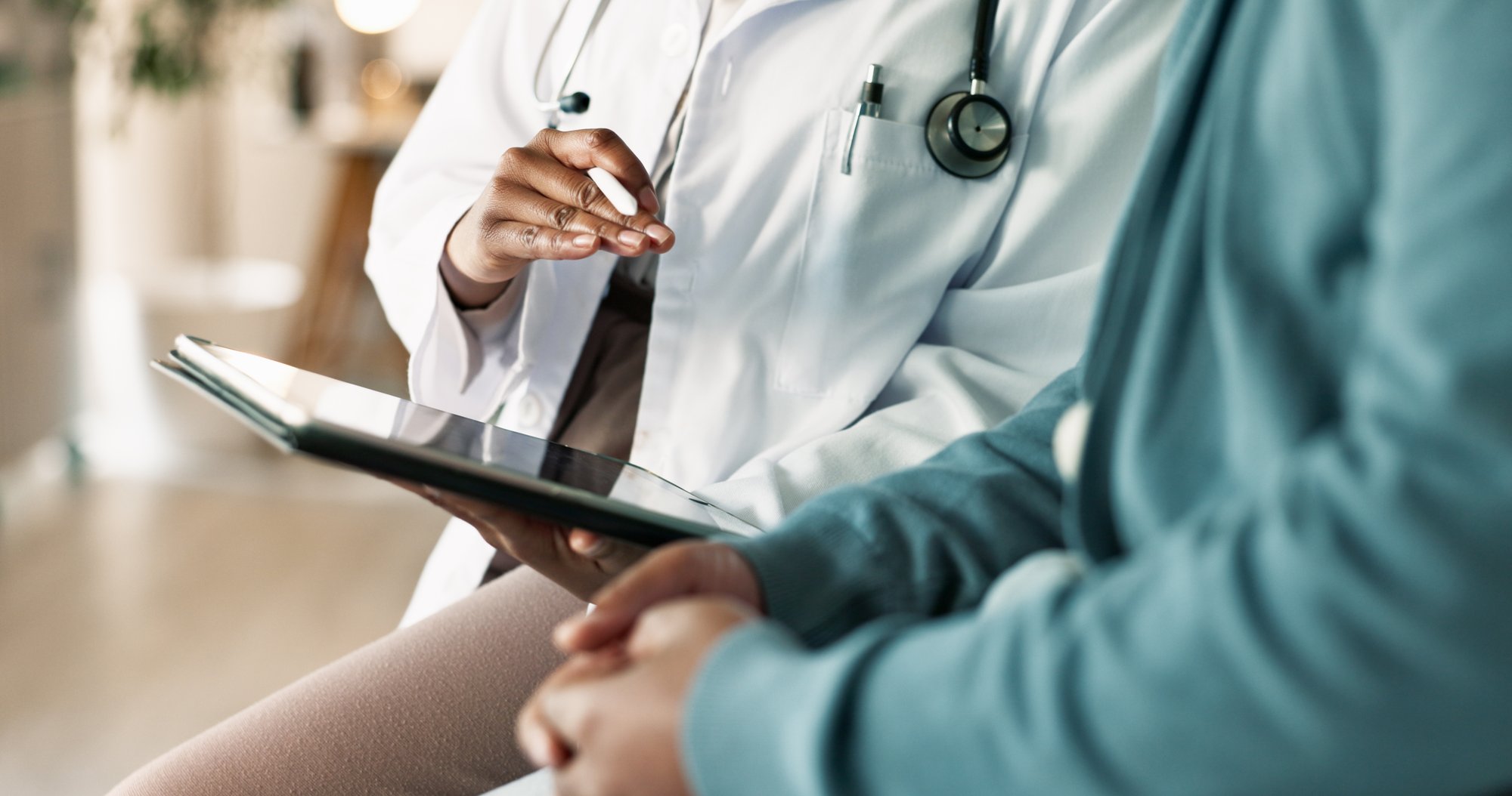 Doctor reviewing chart with patient Doctor reviewing chart with patient